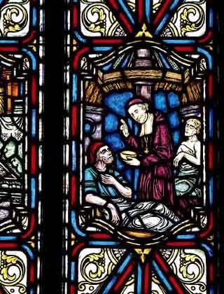 Saint François de Laval servant les pauvres (Vitrail de la Salle des prêtres du Pavillon Jean-Olivier Briand du Séminaire de Québec)